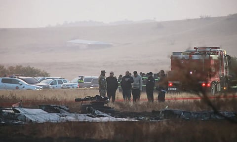 Investigators stand next to debris at a crash site of a Turkish military cargo plane in Georgia’s Sighnaghi municipality, close to the Azerbaijani border (Photo: AP)