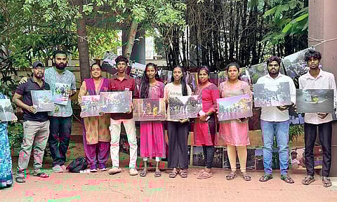 Youngsters of Vyasarpadi, who are also members of the Youth Climate Resilience Movement, holding photos of inundation