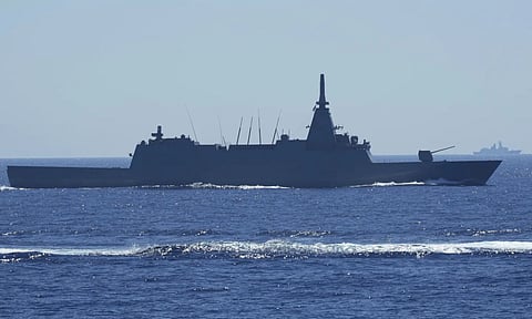 Japanese Maritime Self-Defence Force (JMSDF) frigate JS Noshiro maneuver as a Chinese navy ship is seen at right during the Philippines United States Japan Multilateral Maritime Cooperative Activity off a disputed South China Sea shoal on Friday, March 28, 2025. (AP)&nbsp;