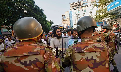 Police use baton to disperse protesters gather outside the demolished residence of Sheikh Mujibur Rahman, Bangladesh's former leader and the father of the country's ousted Prime Minister Sheikh Hasina after the verdict against Hasina, in Dhaka, Bangladesh, Monday, Nov. 17, 2025 (AP)&nbsp;