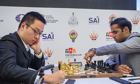 &nbsp;Grandmaster Arjun Erigaisi moves a pawn during his match