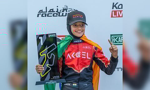 Indian racer Atiqa Mir, 10, celebrates victory in round one of RMC Invitational Karting Series, at Al Ain Raceway, in United Arab Emirates (PTI)