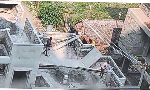 Screengrab of the viral video showing two construction workers atop a building where they committed the heinous act