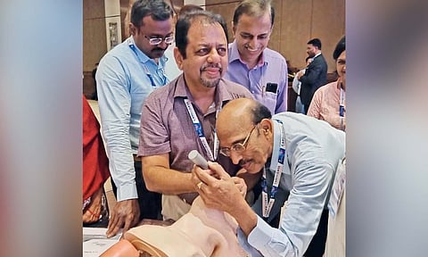 Dr Kumaresan checking the apparatus used for tracheal intubation