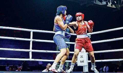 Arundhati Choudhary catches Leonie Muller square on the jaw during the bout
