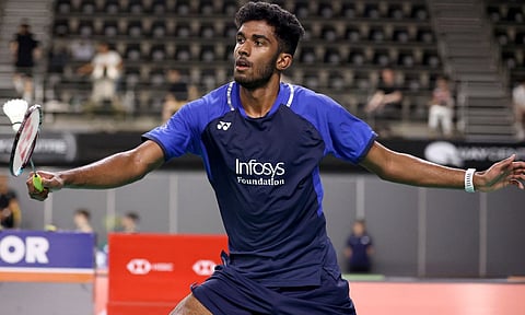 Ayush Shetty returns a serve during his match