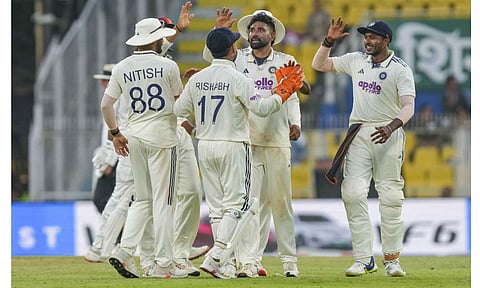 India's Mohammed Siraj, second right, celebrates with teammates after taking the wicket of South Africa's Tony de Zorzi on day one of the second Test cricket match of a series between India and South Africa, at ACA Stadium, Barsapara, in Guwahati, Saturday, Nov. 22, 2025 (PTI)&nbsp;