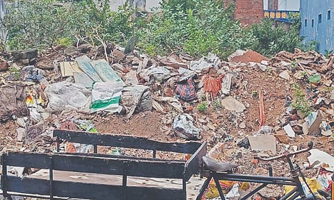 Construction debris takes over the vacant site on Nagappan Street, Meenambal Nagar, Korukkupet