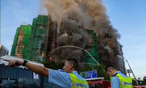 First responders work the scene of a fire at Wang Fuk Court, a residential estate in the Tai Po district of Hong Kong's New Territories on Wednesday, Nov. 26 2025. (AP)