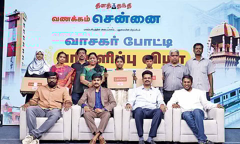 Quiz winners with Vijay Sethupathi and other guests at the event