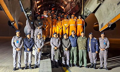 NDRF personnel and others before departing for cyclone-hit Sri Lanka to carry out rescue operations as part of 'Operation Sagar Bandhu', at Hindon airport in Ghaziabad. The Indian Air Force on Saturday delivered 21 tonnes of relief material along with over 80 NDRF personnel and eight tonnes of equipment to Sri Lanka to assist those displaced by floods and landslides caused due to cyclone Ditwah (PTI)