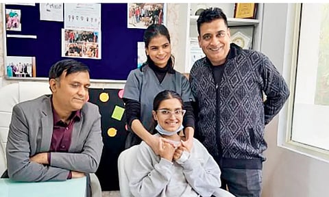 Cuty Mendiratta (seated), her father standing next to her. Pic/X handle
