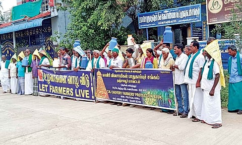 Farmers protest in front of the office