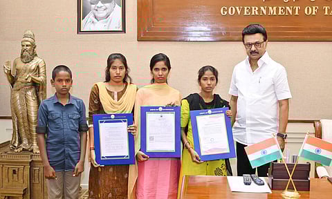 Chief Minister MK Stalin handing over aid to the siblings at the Secretariat on Monday