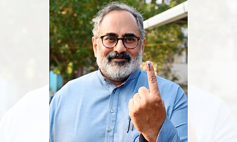 Kerala BJP President Rajeev Chandrasekhar shows his ink-marked finger after casting vote during the first phase of the state local body election, in Thiruvananthapuram (AP)
