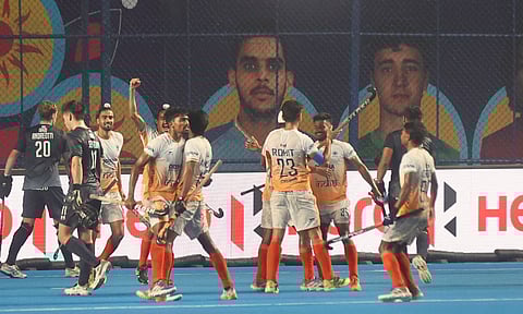 Indian players celebrate after scoring against Argentina