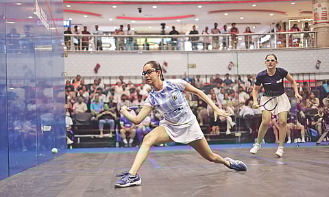 Anahat Singh goes for a straight drive against Laura Silva