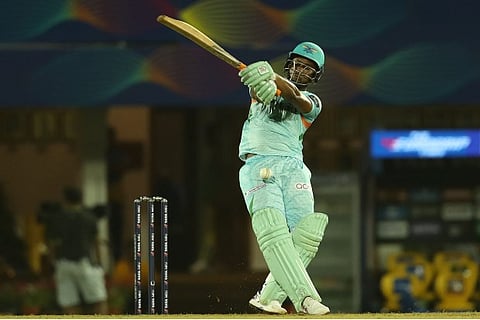 Erin Lewis hits half century