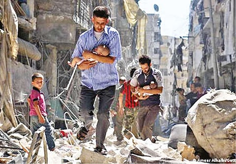 Men rescuing their children from the rubbles.