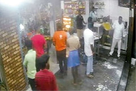 Screen grab of the accused attacking the shop