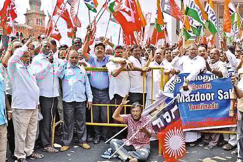 All India Workers Union members protest near Kuralagam on Tuesday