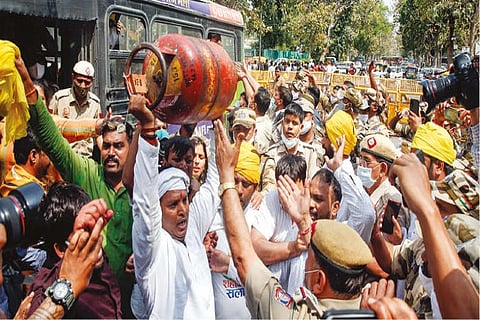 Police in a scuffle with Indian Youth Cong members during their protest over hike in prices