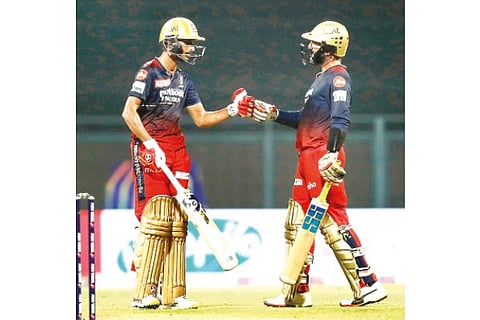 Shahbaz Ahmed (left) and Dinesh Karthik helped RCB to a thrilling win