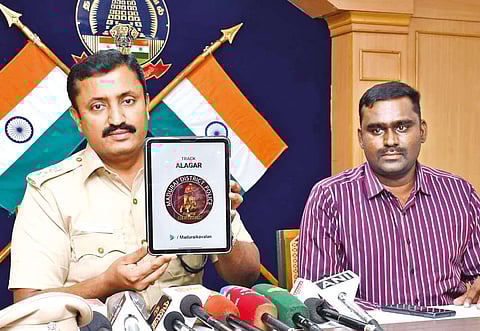Madurai SP V Baskaran explaining the feature of ?Track Alagar? on ?Madurai Kaavalan? mobile app on Saturday