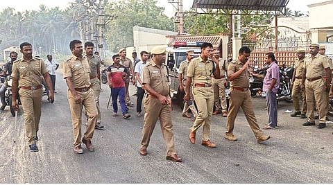 Police team walks into the oil factory in Modakurichi on Thursday