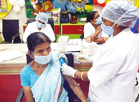 A senior citizen getting a vaccine shot