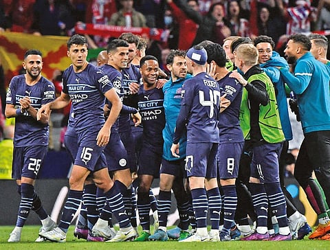 Manchester City players celebrate after securing semi-final qualification