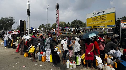 People lined up to buy kerosene oil