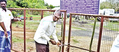 HR&CE officials sealing a retrieved temple property in Thanjavur on Friday.