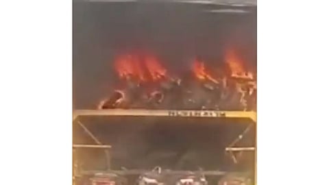 Electric scooters burning in transport container (Source: IANS)