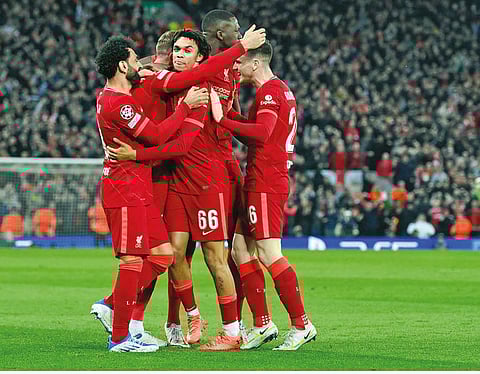 Liverpool players celebrate after scoring the opening goal against Villarreal