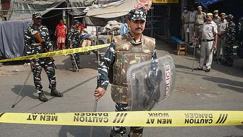 Security personnel keep vigil after clashes broke out between two communities during a Hanuman Jayanti procession