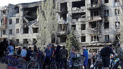 Local residents gather to receive humanitarian aid during Ukraine-Russia conflict in the southern port city of Mariupol, Ukraine