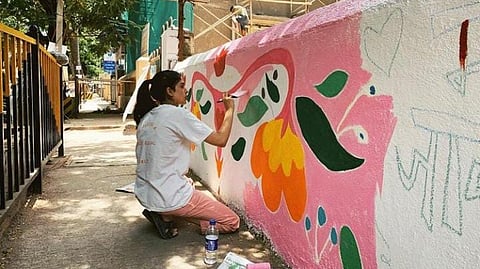 Navya Naveli Nanda painting a wall