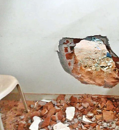 The hole drilled on the wall of the clinic to enter the pawnshop in Namakkal on Saturday night