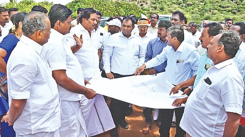 Minister for Commercial Taxes, Registration and Stamp Law P Moorthy inspecting a site to build a new stadium