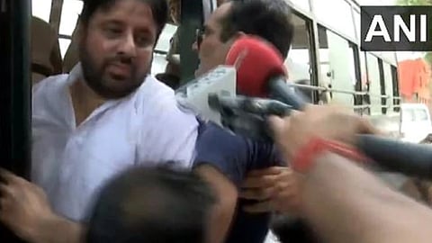 Aam Aadmi Party (AAP) MLA Amanatullah Khan being arrested.