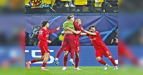 Liverpool players celebrate after scoring the opening goal against Villarreal