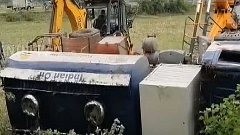 The truck being helped by JCB