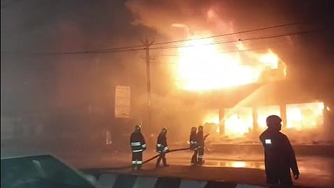 Firefighters dousing the fire.