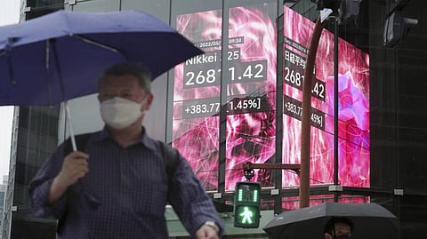 Stock board showing Japan's Nikkei 225 index at a securities firm