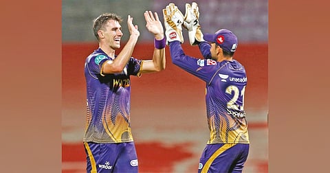 Pat Cummins celebrates the wicket of Mumbai opener Ishan Kishan
