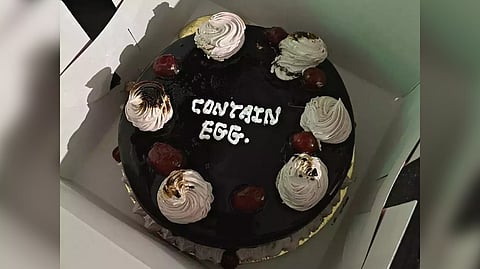 Contain egg written as message on the cake