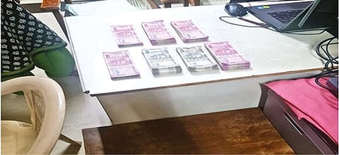 The seized bribe money in Tirupur on Friday