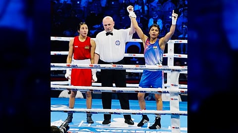 Nikhat Zareen (in blue) celebrates her semi-final victory