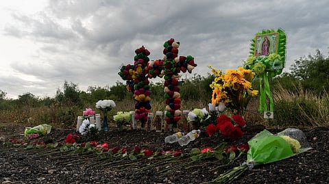 Crosses and water bottles kept as a respect at the site where the migrants died.